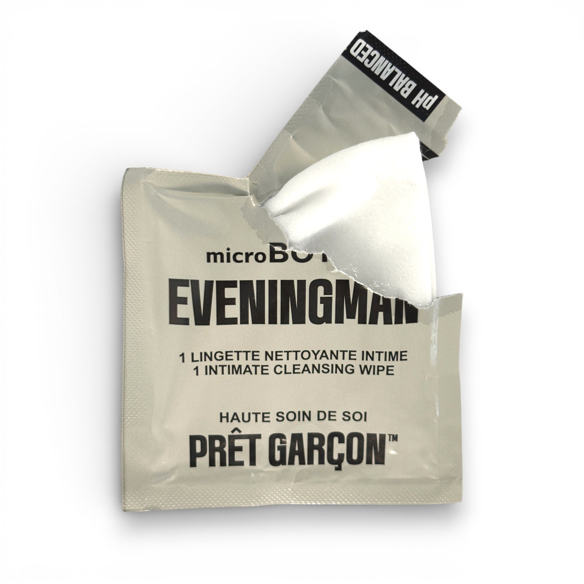 Opened PRÊT GARÇON EVENINGMAN intimate cleansing wipe sachet, luxury men’s intimate care, minimalist packaging.