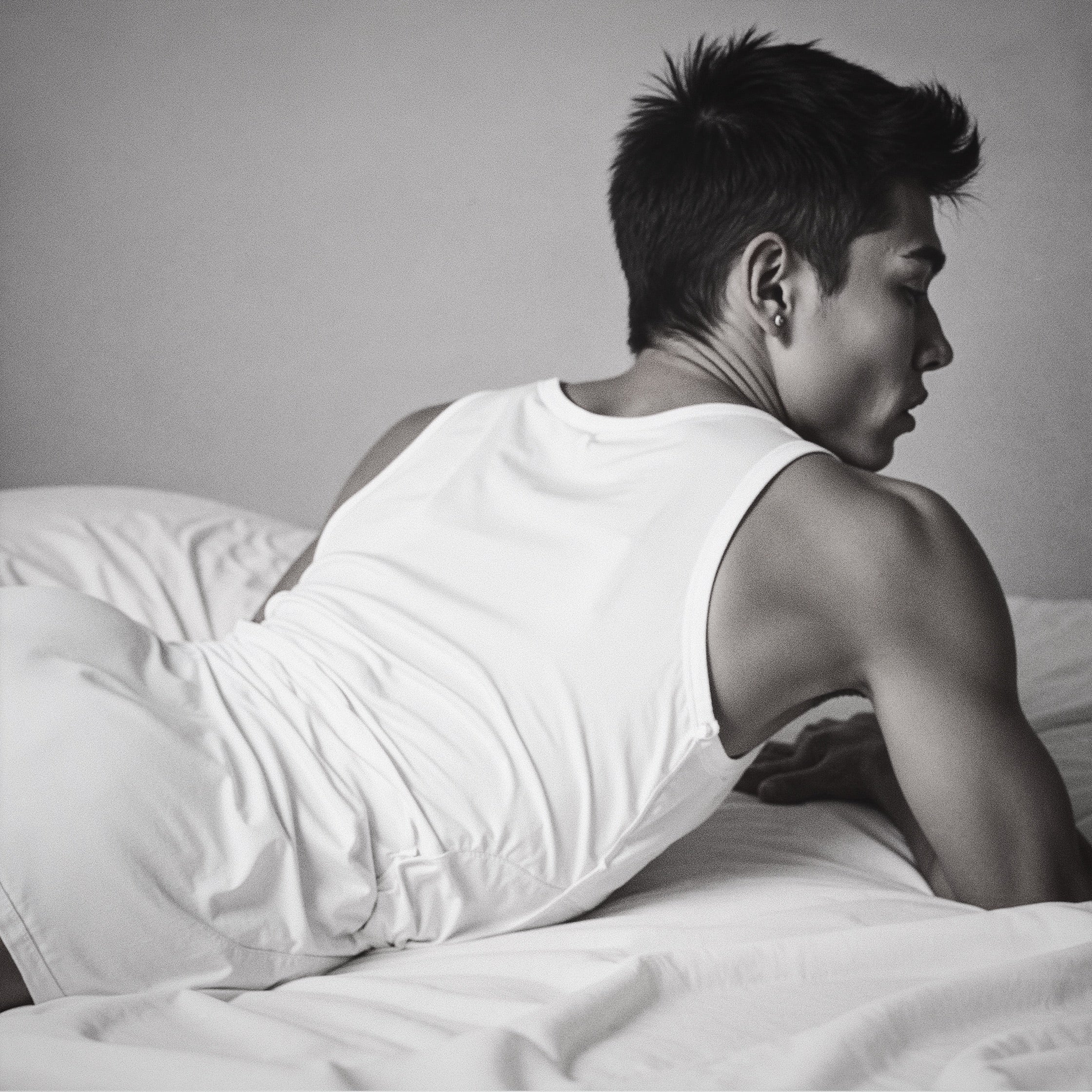 Lifestyle shot of EVENINGMAN intimate wipes styled on bedding